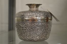 An Eastern embossed white metal bowl and cover.