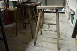 A set of four beech stools.