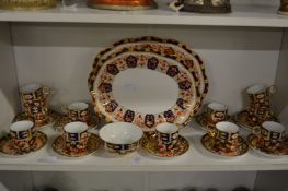 A quantity of Royal Crown Derby Imari coffee cups and saucers together with two similar plates.