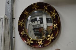 A decorative circular mirror.