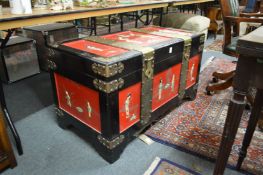 A decorative Chinese brass bound and lacquer coffer.