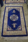 A Chinese blue ground rug 5' x 3'.