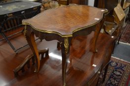A Continental brass mounted parquetry decorated coffee table.