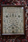 A 19th century sampler by Anne Collins aged 10 years dated July 22nd 1850.
