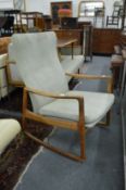 A Scandinavian teak framed rocking chair.