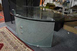 A stylish bauhaus glass and chrome elliptical shaped coffee table.