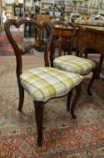 A pair of Victorian rosewood dining chairs.