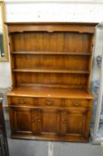A good oak dresser with delft rack, three drawers and three cupboard doors.