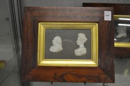 A set of three 19th century rosewood framed plaques depicting relief cast busts of ladies and