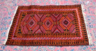 A small Persian design rug, with three large central medallions 4'6