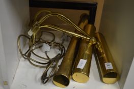 Three brass picture lights.