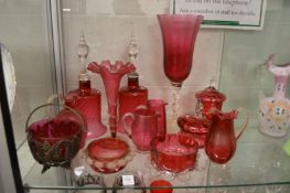 A collection of cranberry glassware.