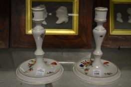 A pair of Herend porcelain candlesticks.