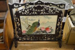 A Chinese porcelain and hardwood revolving table screen.