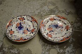 A pair of ironstone warming dishes.