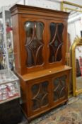 A Continental mahogany four door display cabinet or bookcase.