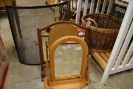Two dressing table mirrors, a spark guard and a wicker basket.
