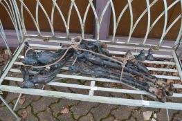 A pair of cast iron bench ends (faults).