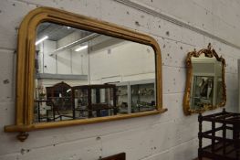 Two decorative gilt framed overmantle mirrors.