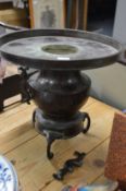 A Japanese bronze twin handled tripod Usubata vase.
