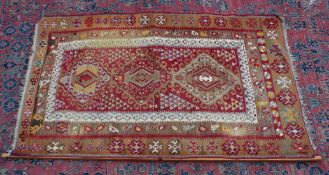 A Kelim rug, beige and red ground with geometric decoration 5'7