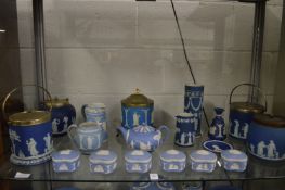 A collection of Wedgwood blue jasperware to include biscuit barrels, boxes and covers etc.