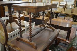 A Victorian rosewood stretcher table.