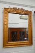 A decorative gilt framed mirror.