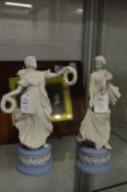 A pair of Wedgwood jasperware figures of classical young ladies.