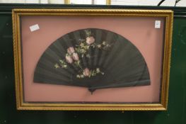 Decorative fan, framed and glazed.