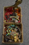 A quantity of bijouterie and a hand mirror.