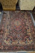 A Persian carpet, green ground with floral decoration 6'10