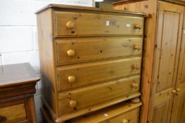 A pine chest of drawers.