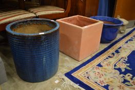 Three large plant pots.