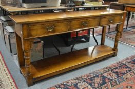 A good reproduction oak pot board three drawer dresser base.