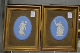 A pair of blue jasperware oval plaques, framed.