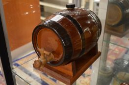 A Doulton Lambeth whisky keg on stand.