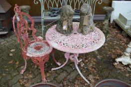 An aluminium patio table and chair.