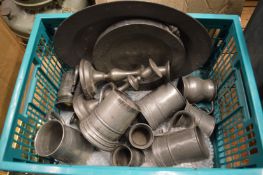 A collection of pewter tankards etc.