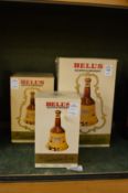 Three boxed Bells whiskey decanters, various sizes.