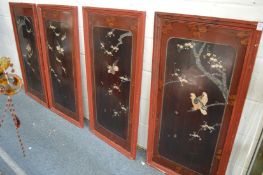 A set of four Japanese lacquer panels depicting birds.