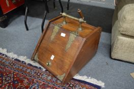 A Victorian brass bound walnut coal box.