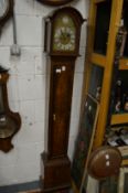 A good walnut cased grandmother clock with eight day movement.