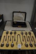 A cased set of twelve silver coffee spoons and sugar tongs together with a cased christening set.