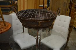 A cast iron fire pit.