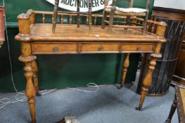 A Continental writing desk with galleried back and single frieze drawer on turned legs with brass