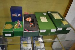 A collection of boxed military figures.