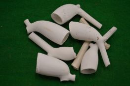 A collection of clay pipe bowls.