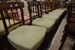 A set of six Georgian style mahogany dining chairs, early 20th century, with spindle supports,