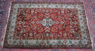 A good Persian carpet, burgundy ground with parrots amongst flora and fauna 7' x 4'8